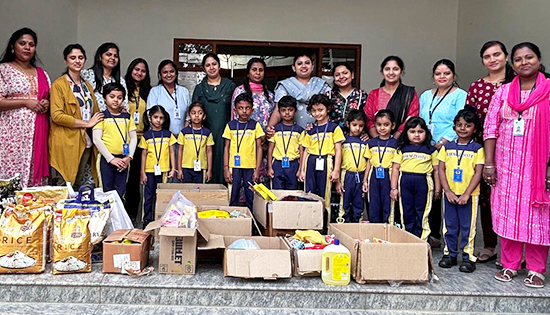 Teacher and students of Ebenezer International School Bangalore doing donations